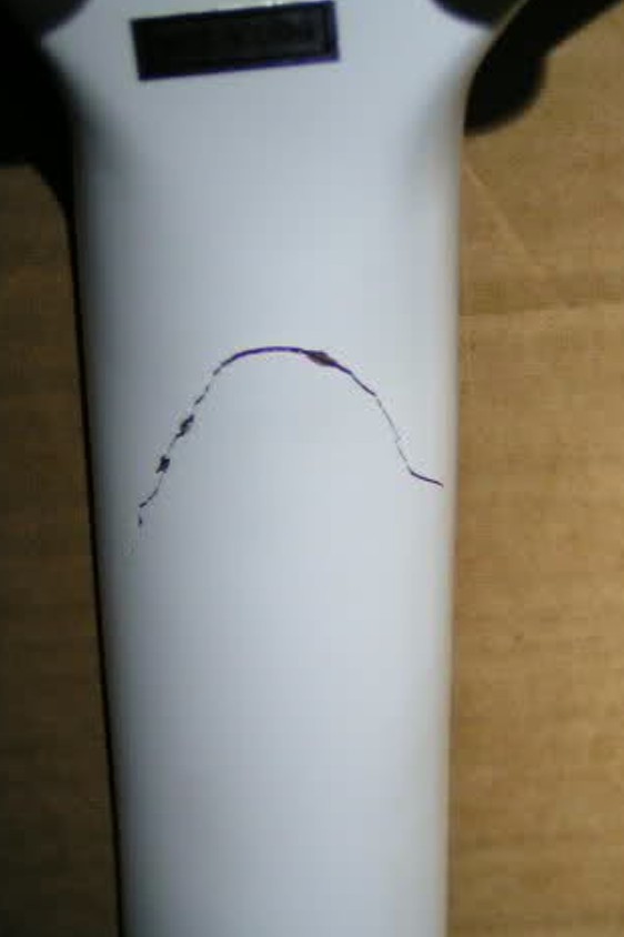 Picture of a crack on the back of electric guitar neck